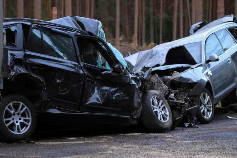 Two cars with heavy front-end accident damage