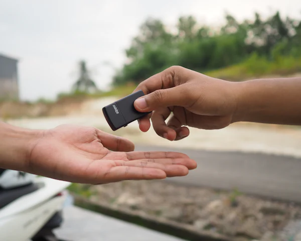 Car key being handed over at the time of sale