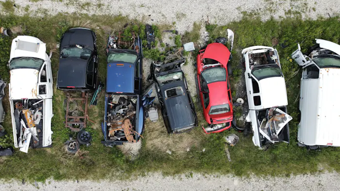 Aerial view of end-of-life cars at a vehicle recycling yard